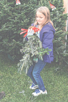 Smell of evergreen lures tree shoppers: Families come out on opening day to get their pick of the farm